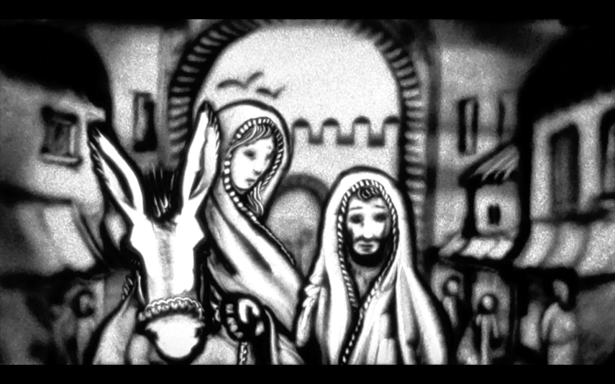Jozef en Maria onderweg naar Bethlehem. Maria zit op een ezel, Jozef loopt er naast.